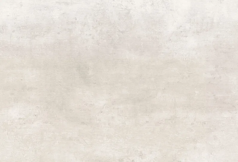 Strukturierte, helle Wandoberfläche mit feiner Beton- oder Putztextur – neutraler Hintergrund für modernes Webdesign.